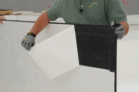 Peeling-the-backing-off-solar-panel.jpeg