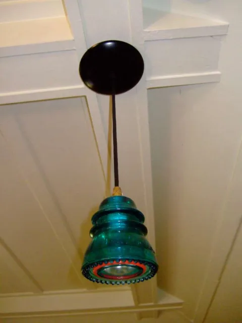 What can you use old glass insulators for? How about as mini pendant lights! 