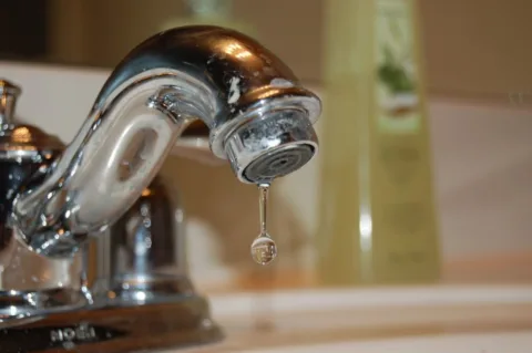 a dripping water faucet