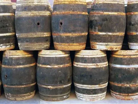 Wood barrels, plastic barrels, and metal 55 gallon barrels can be found for free -- if you know where to look for them. Start here! 