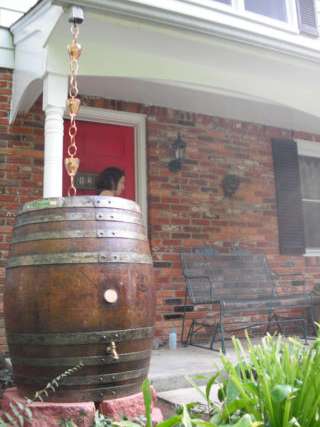 Wooden rain barrels and rain chains are often considered the best looking... and they are affordable! 